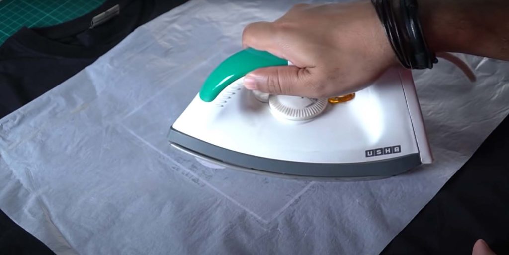 Use an iron to let the print stick to the t-shirt.